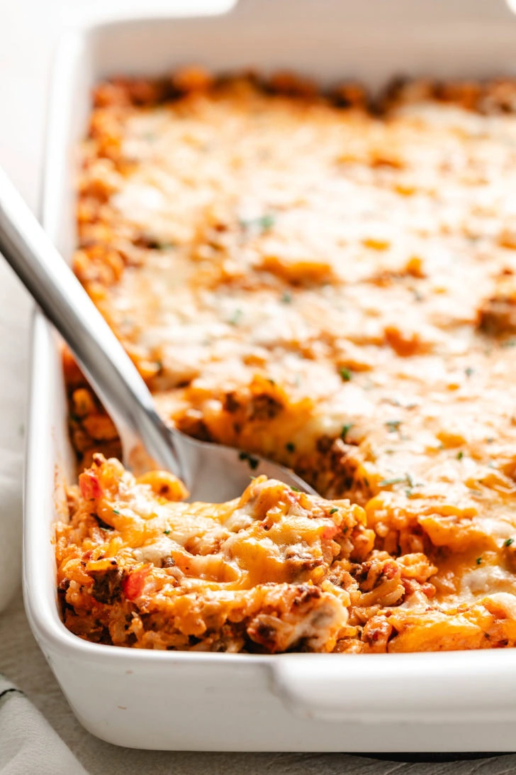 Spoon scooping taco bake.