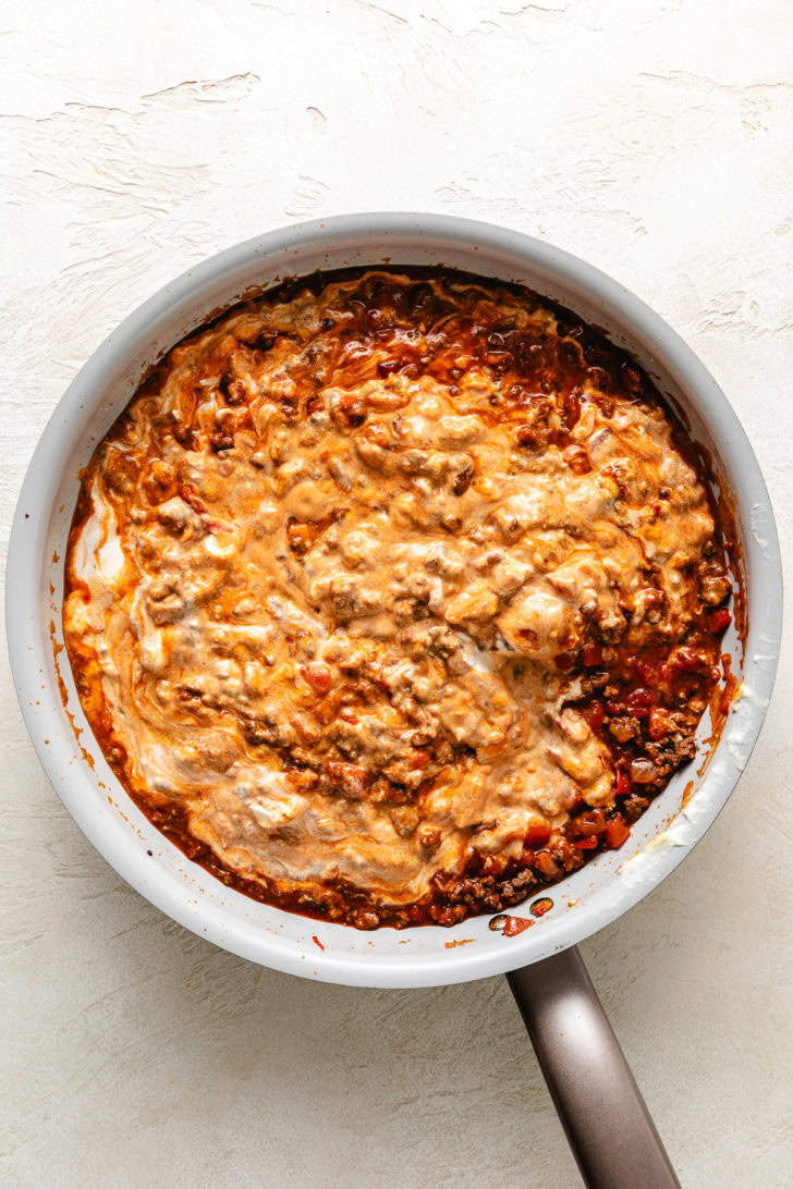 Cream cheese and sour cream mixed with ground beef and salsa.