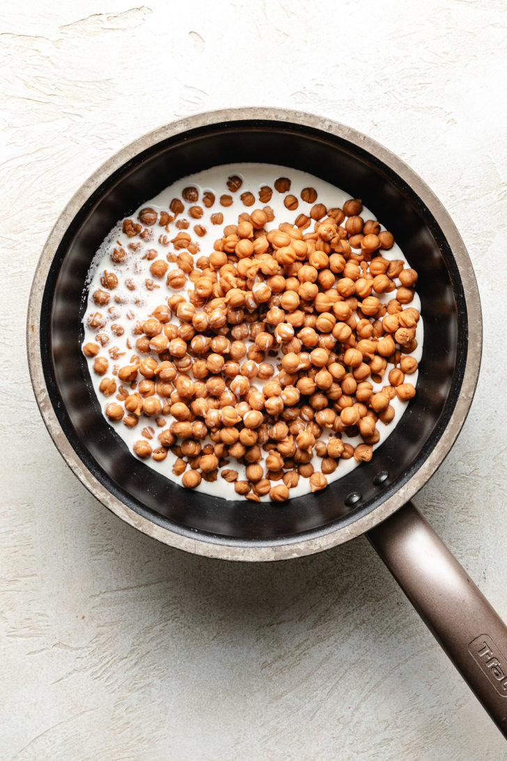 Caramel bits and cream in a pan.
