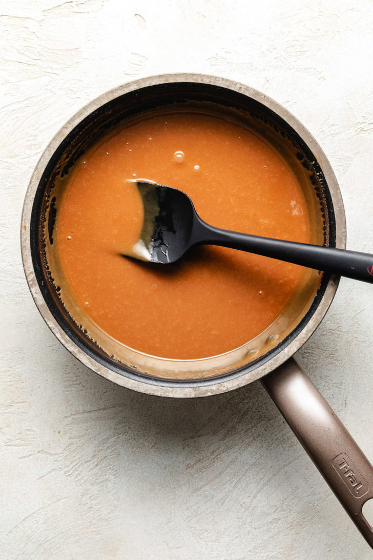 Pan of melted caramel sauce.
