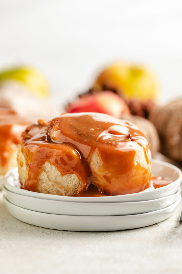 Caramel sauce over a cinnamon roll.