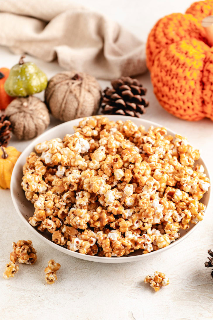 Large bowl of caramel covered popcorn.