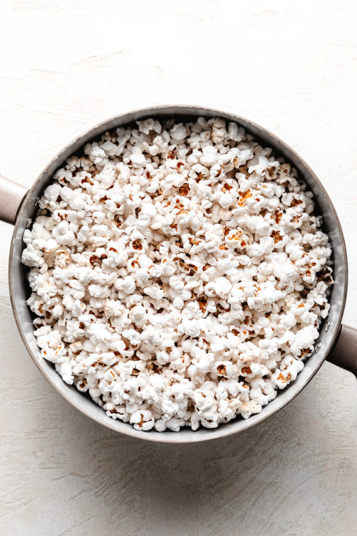 Popped popcorn in a pan.