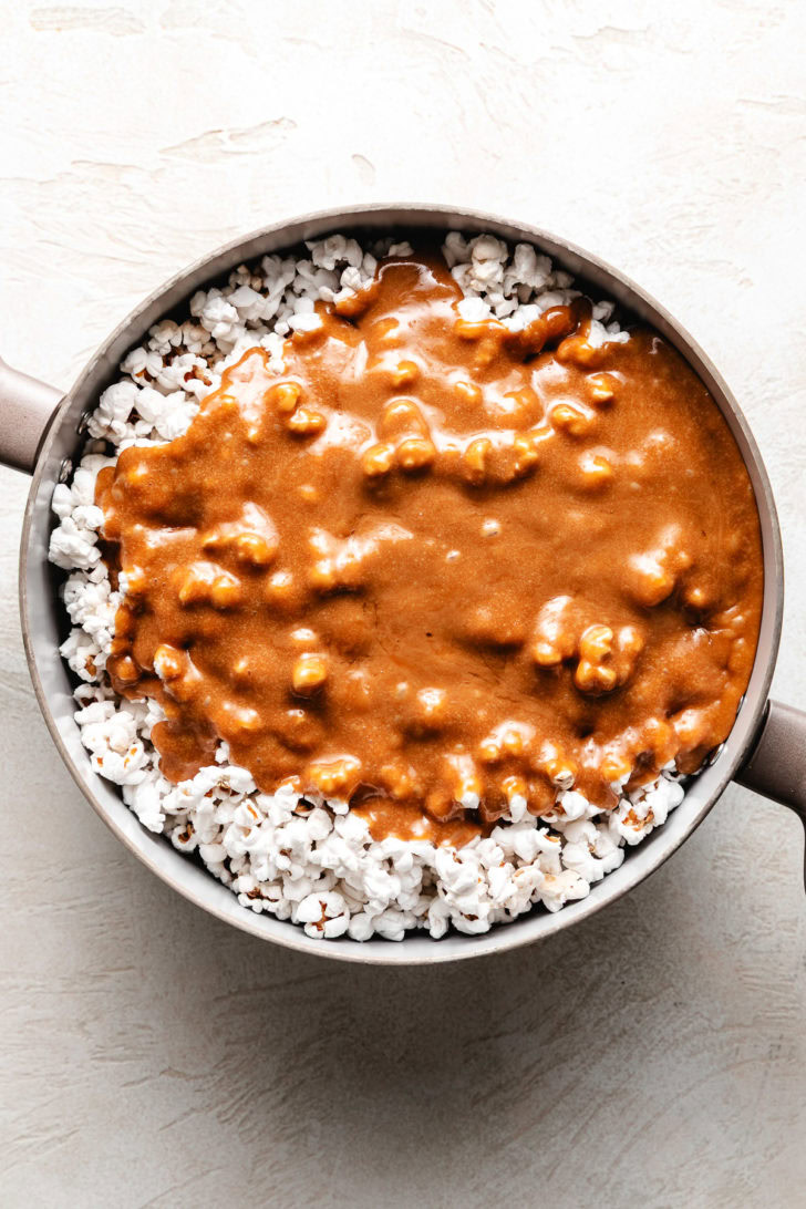 Caramel sauce poured over popcorn.