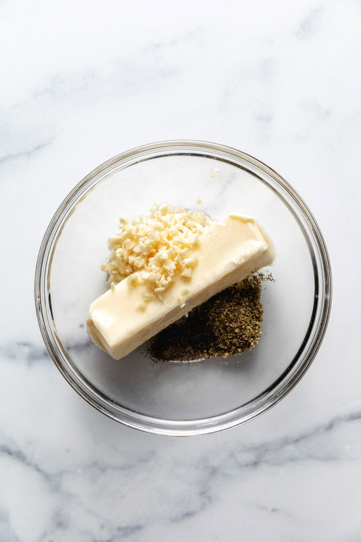 Cheesy Feta Garlic Bread Butter, garlic, and seasonings in a bowl.