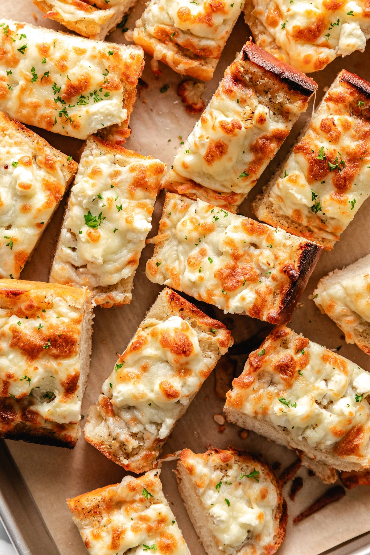 Overhead view of cheesy garlic bread.