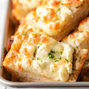 Cheesy Feta Garlic Bread Close up view of slices of feta garlic bread.