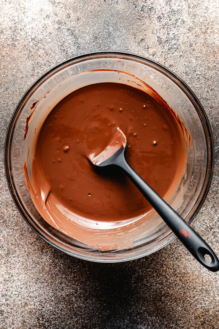 Bowl of melted chocolate almond bark.