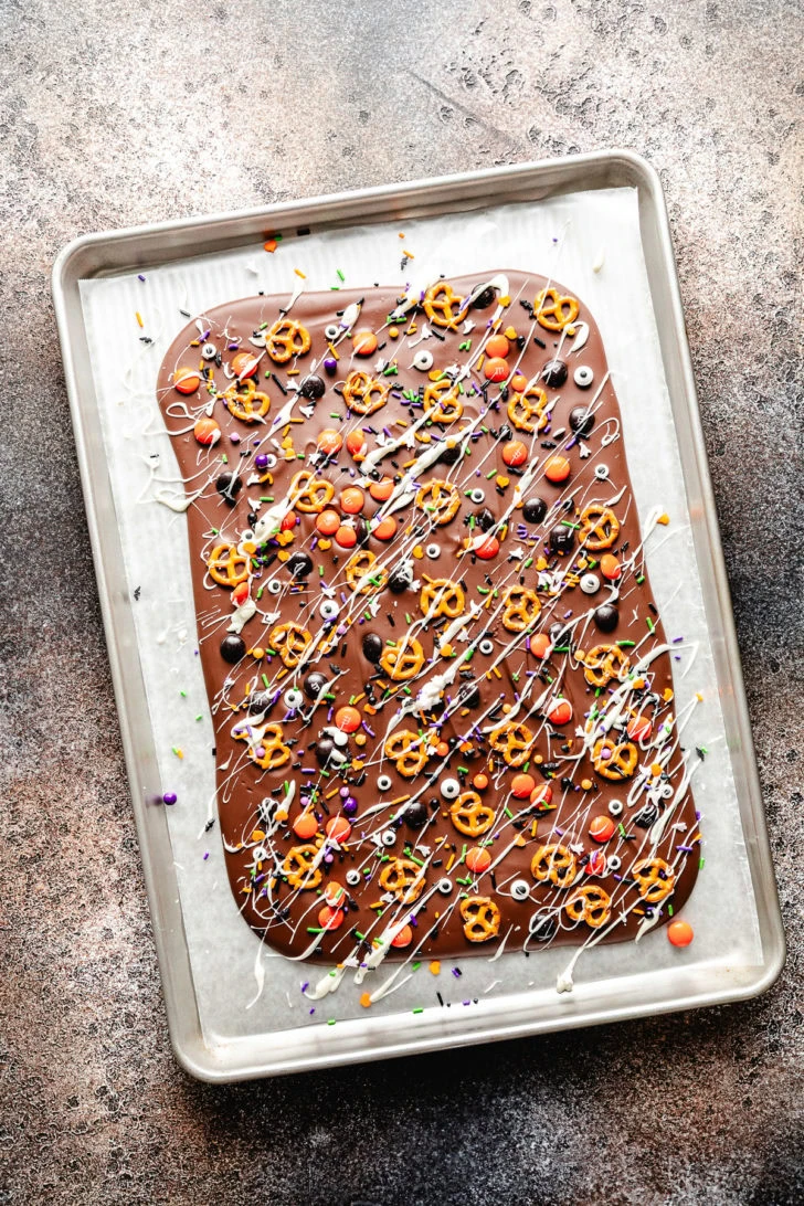 Baking sheet filled with halloween chocolate bark.