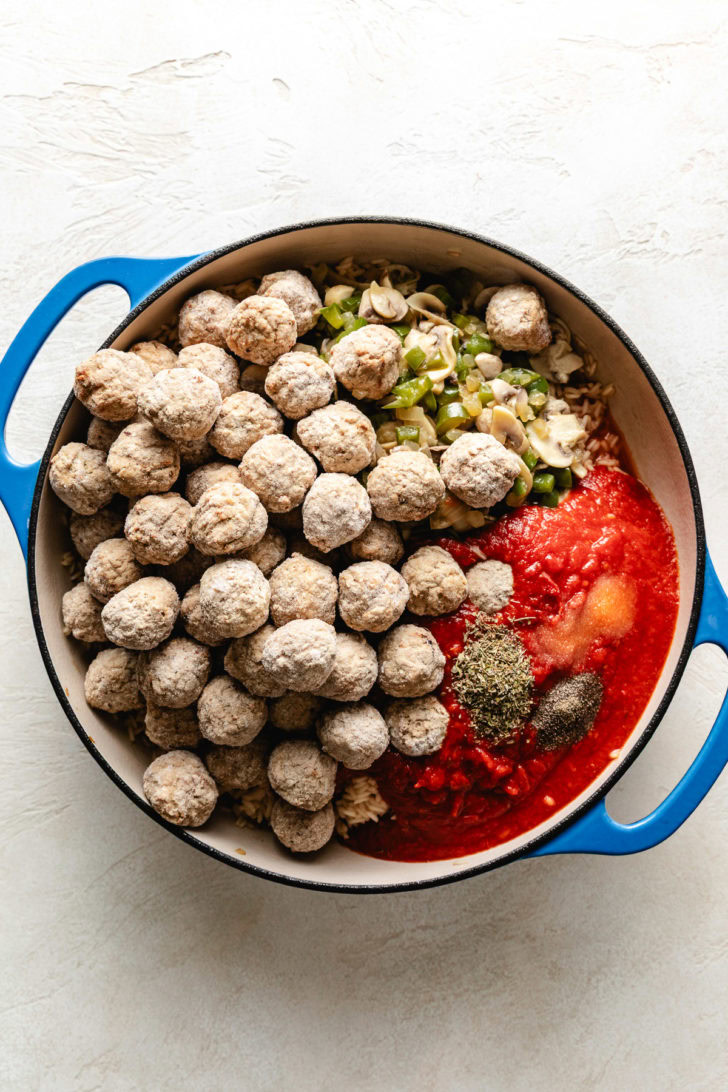 Frozen meatballs, marinara, and spices poured over rice.