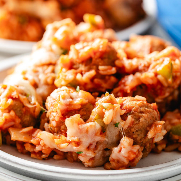 Close up view of rice and meatballs.