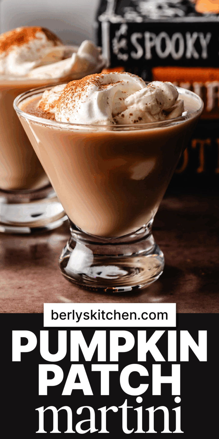 Close up view of a pumpkin martini with whipped cream.