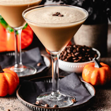 Pumpkin spice espresso martini sitting on a gray plate.