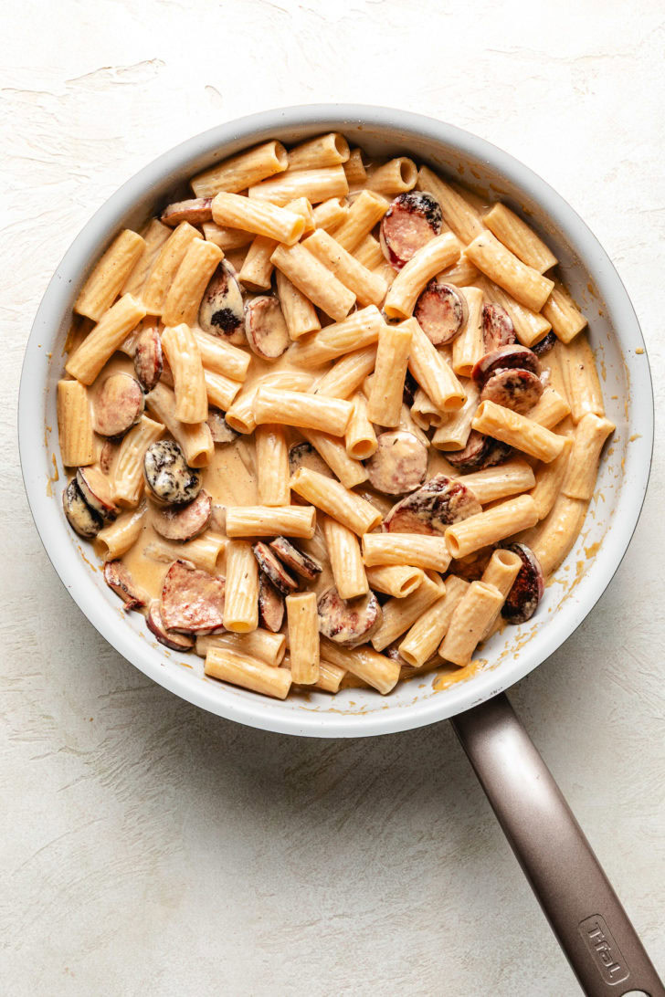 Skillet filled with spicy cajun alfredo.