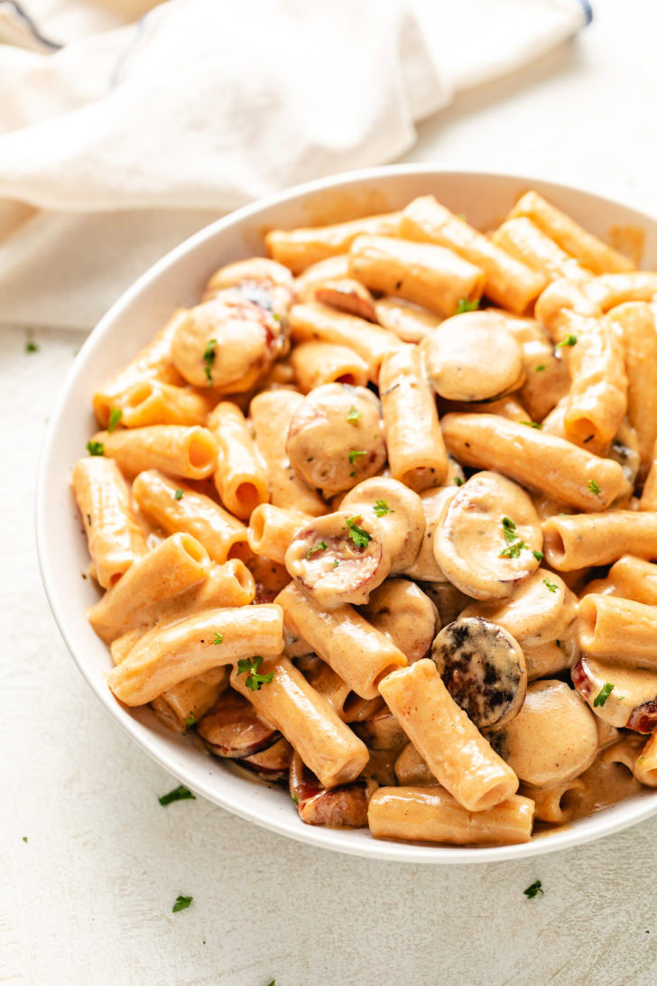Serving dish of smoked sausage cajun alfredo.