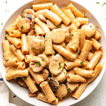 Close up view of bowl of cajun sausage pasta.