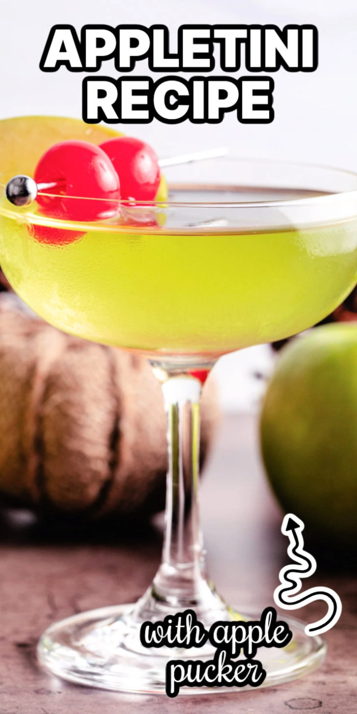 Cherries and apple slice on a martini.