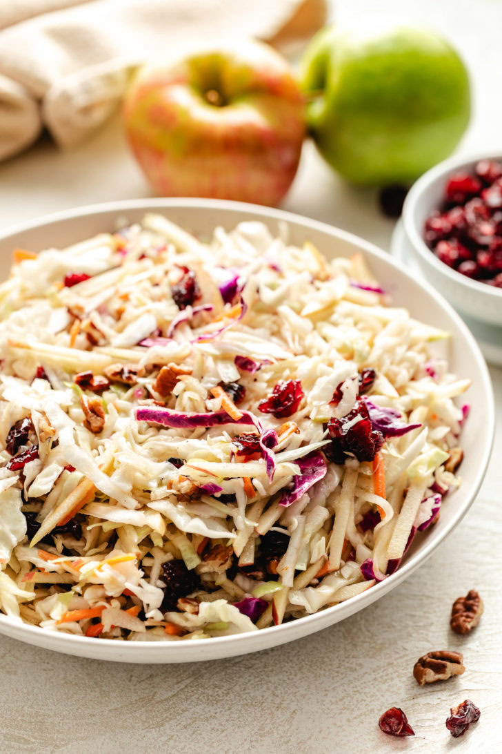 Cranberry apple slaw in a white dish.