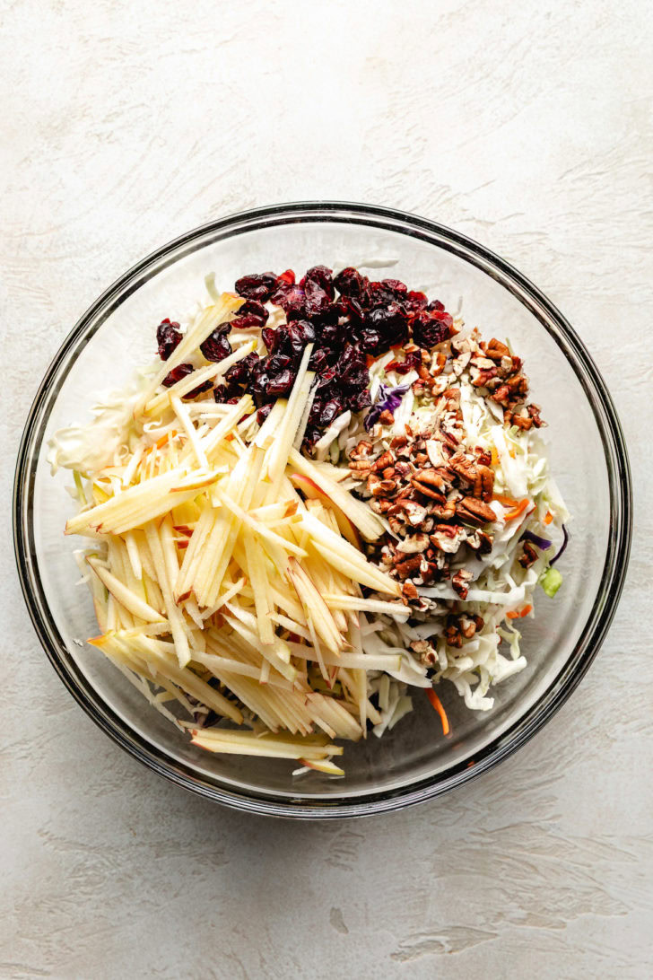 Ingredients for coleslaw in mixing bowl.