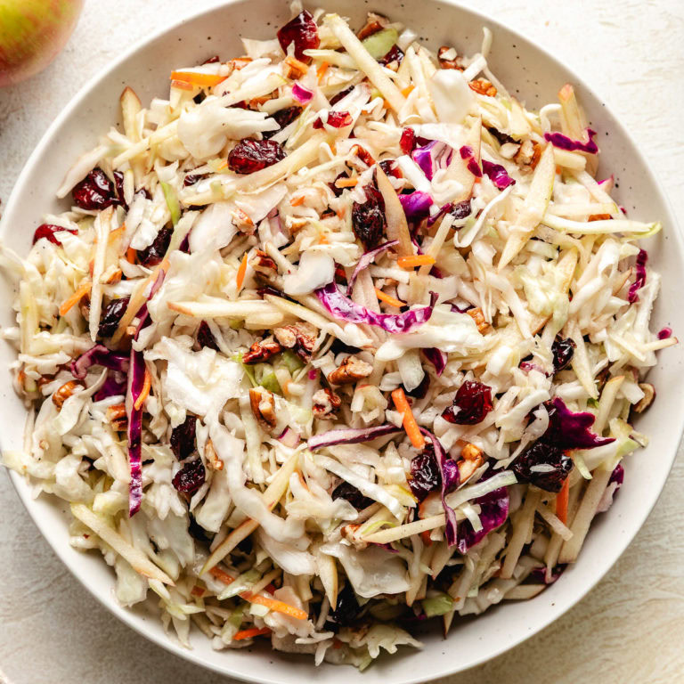 Close up view of apple cranberry slaw.