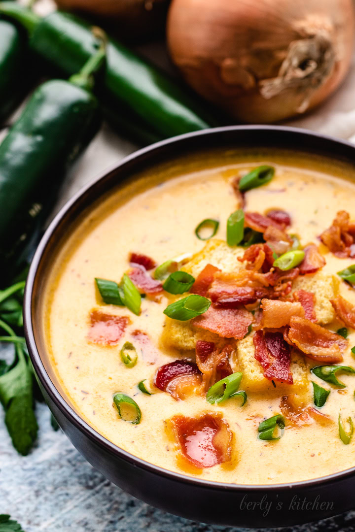 Creamy JalapeÑO Beer Cheese Soup Bowl of jalapeño beer cheese soup topped with bacon.