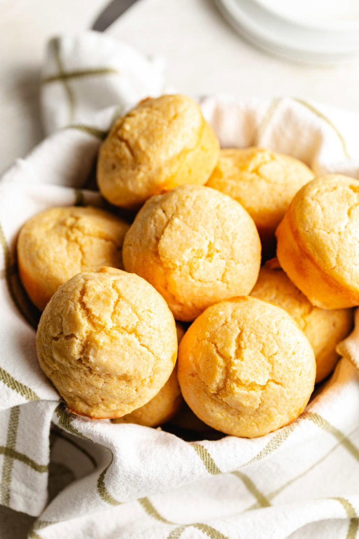 Moist Cornbread Muffins Batch of cornbread on a green and white towel.
