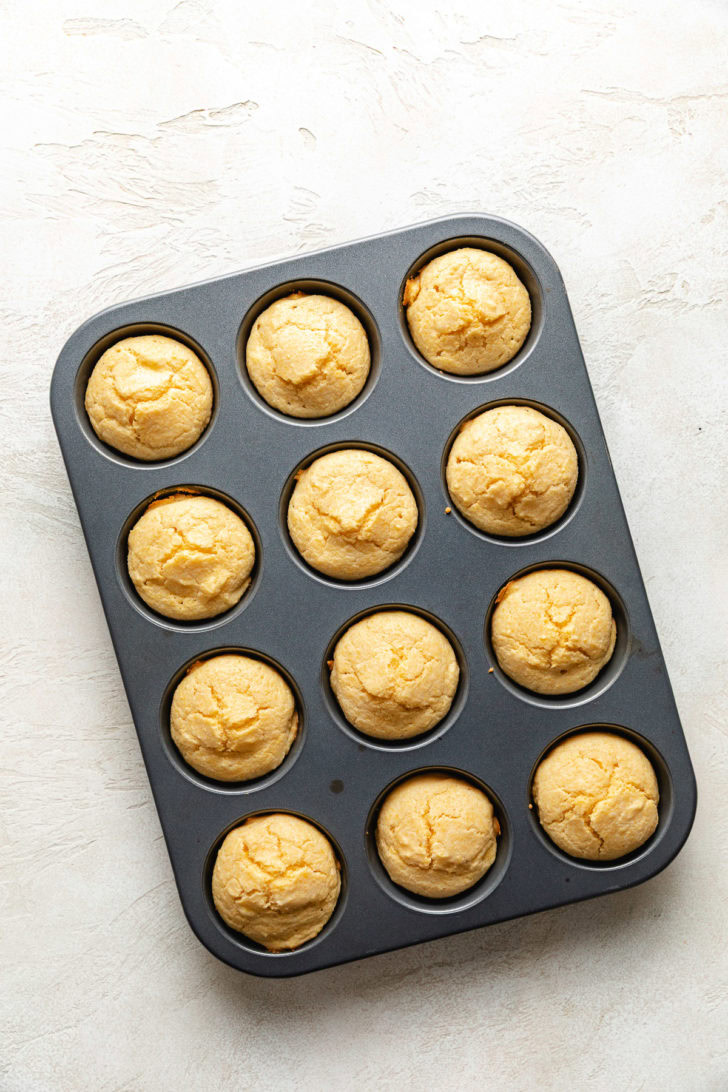 Moist Cornbread Muffins Overhead view of cornbread muffins in a pan.