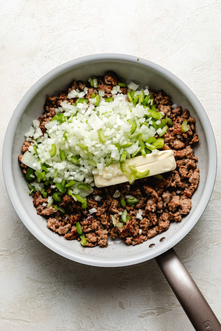 Classic Sausage Stuffing Pan of sausage, butter, onion, and celery.