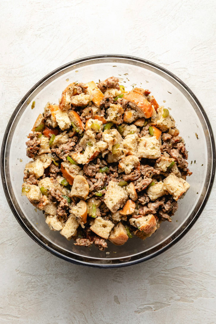 Classic Sausage Stuffing Stuffing ingredients mixed in a bowl.