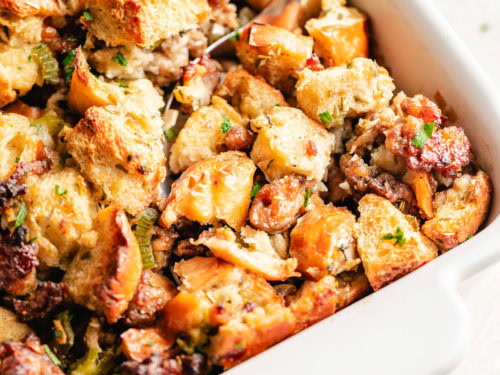 Close up view of golden brown sausage stuffing.