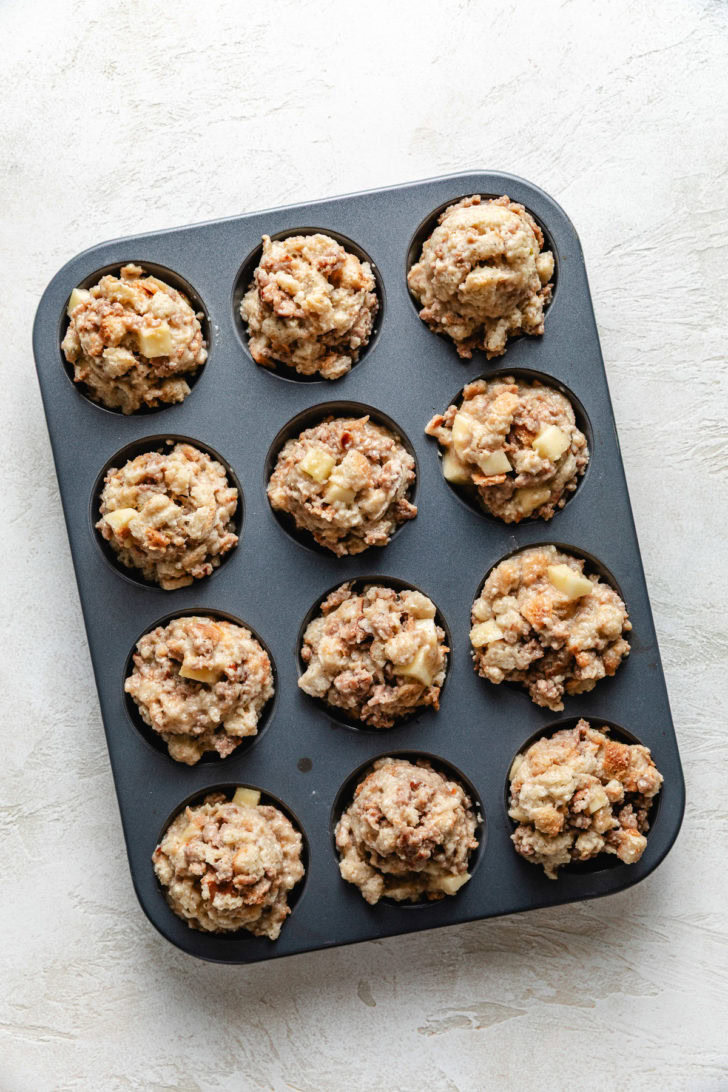Stuffing Muffins Unbaked stuffing mix in a muffin pan.