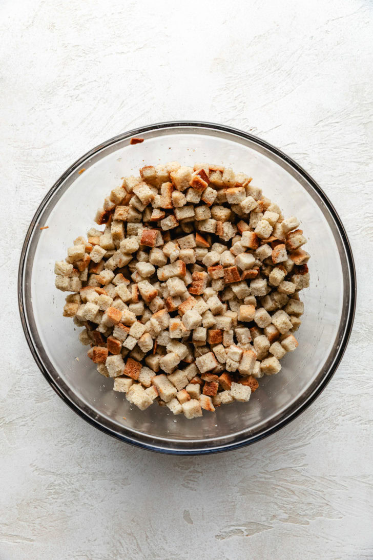 Stuffing Muffins Glass bowl filled with packaged stuffing mix.