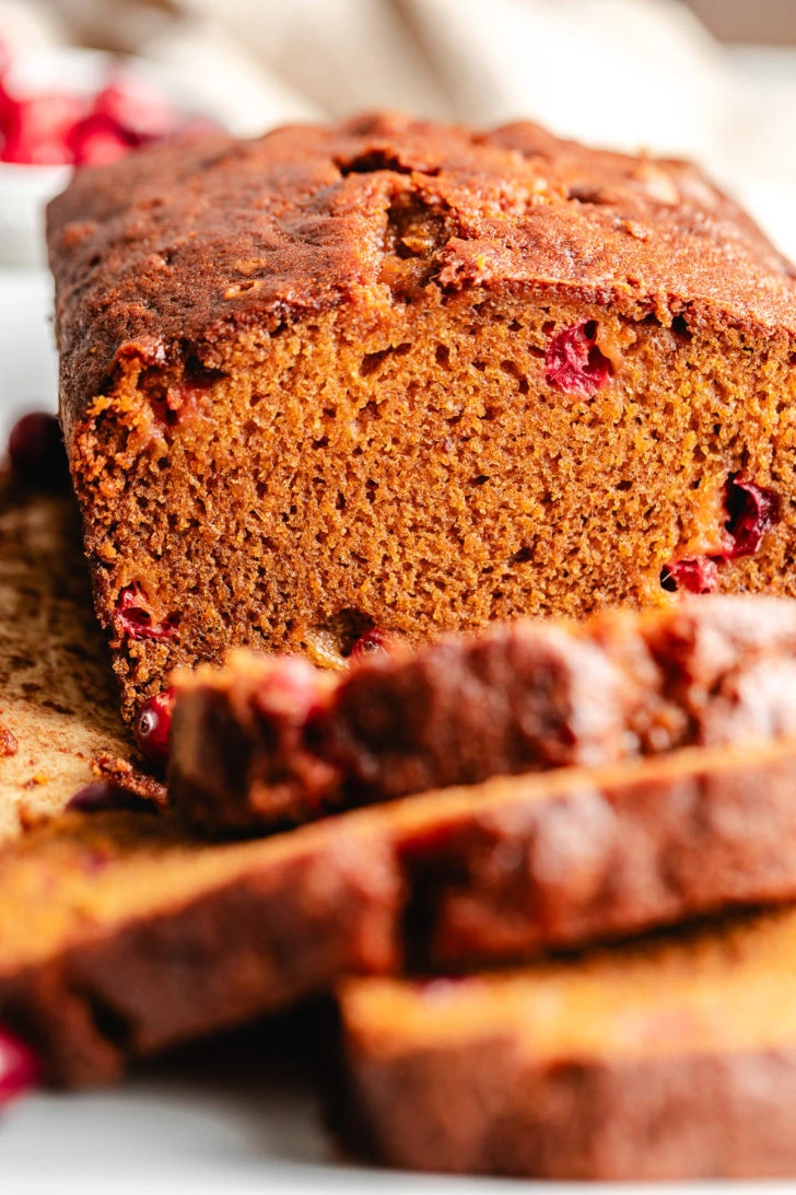 Loaf of pumpkin bread with cranberries.