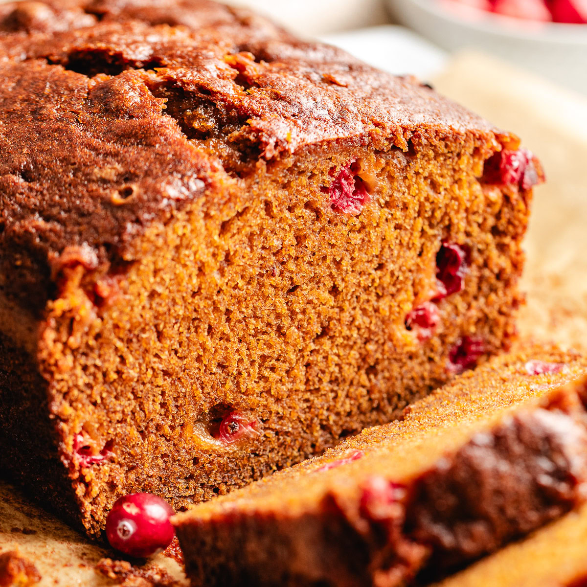 Close up view of pumpkin cranberry bread.