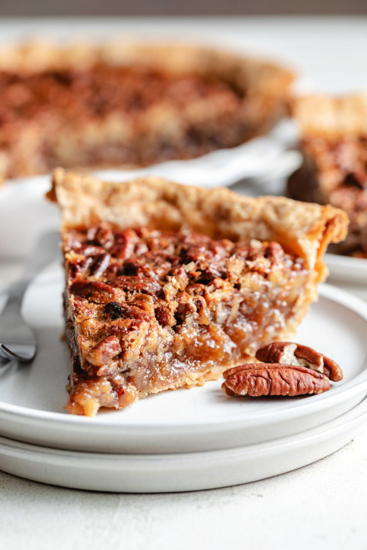Close up view of pecan pie on a plate.