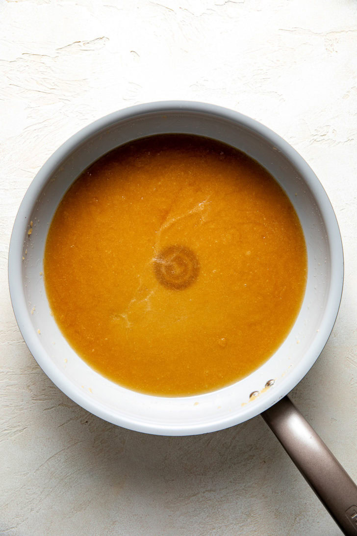 Melted butter and sugar combined in a pan.