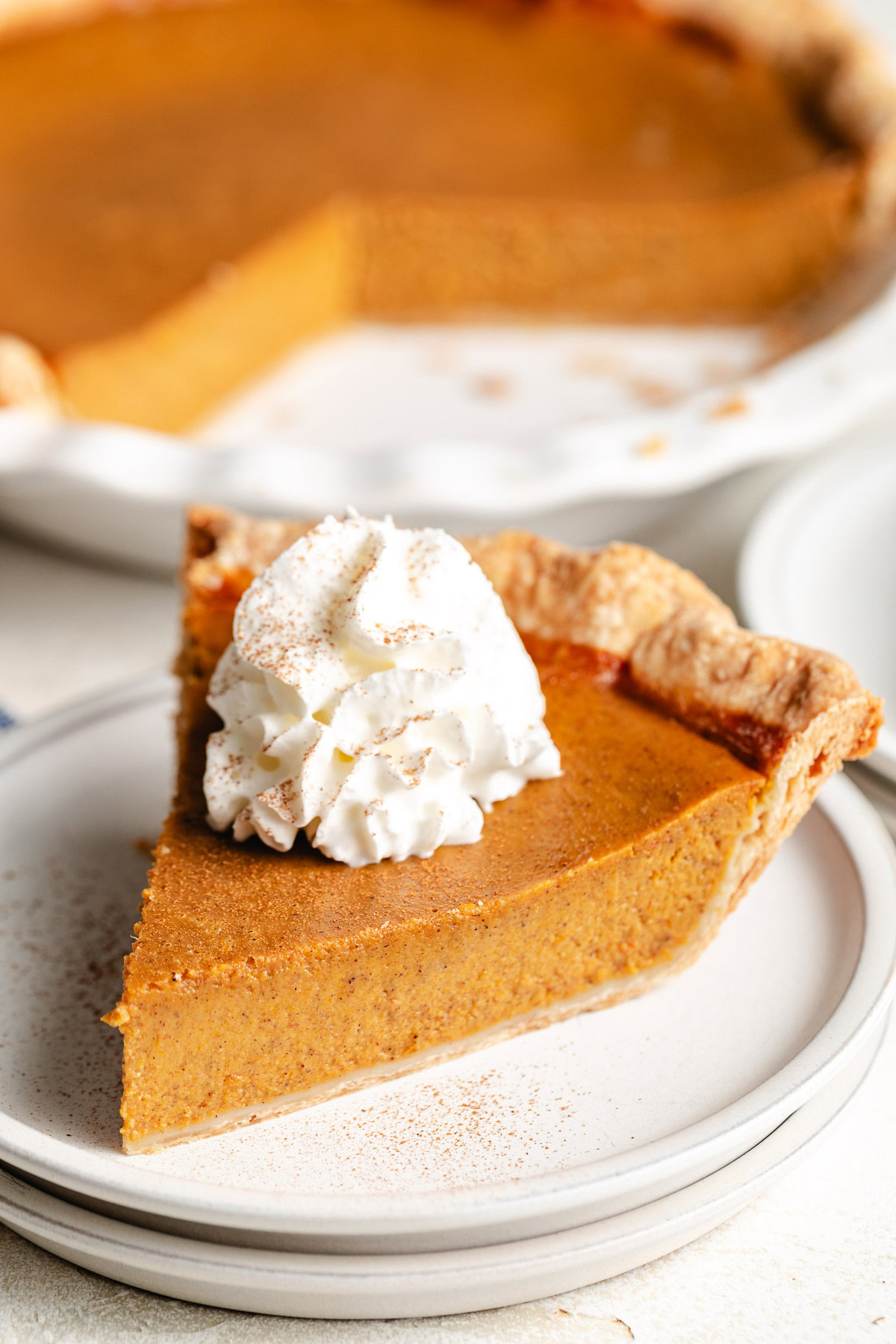 Pumpkin pie with whipped cream.