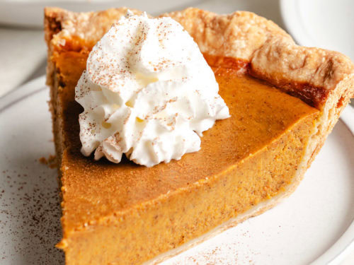 Close up view of a slice of pumpkin pie.