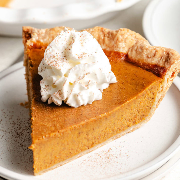 Close up view of a slice of pumpkin pie.