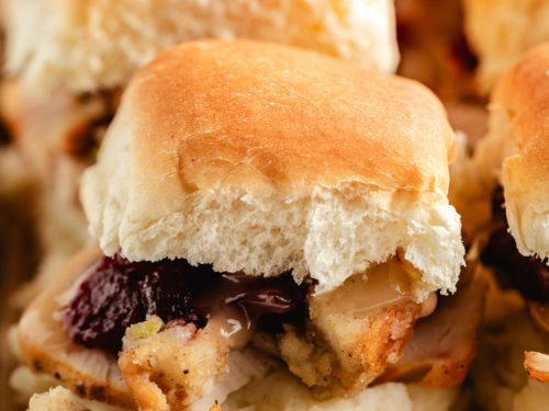 Close up view of thanksgiving sliders on a pan.