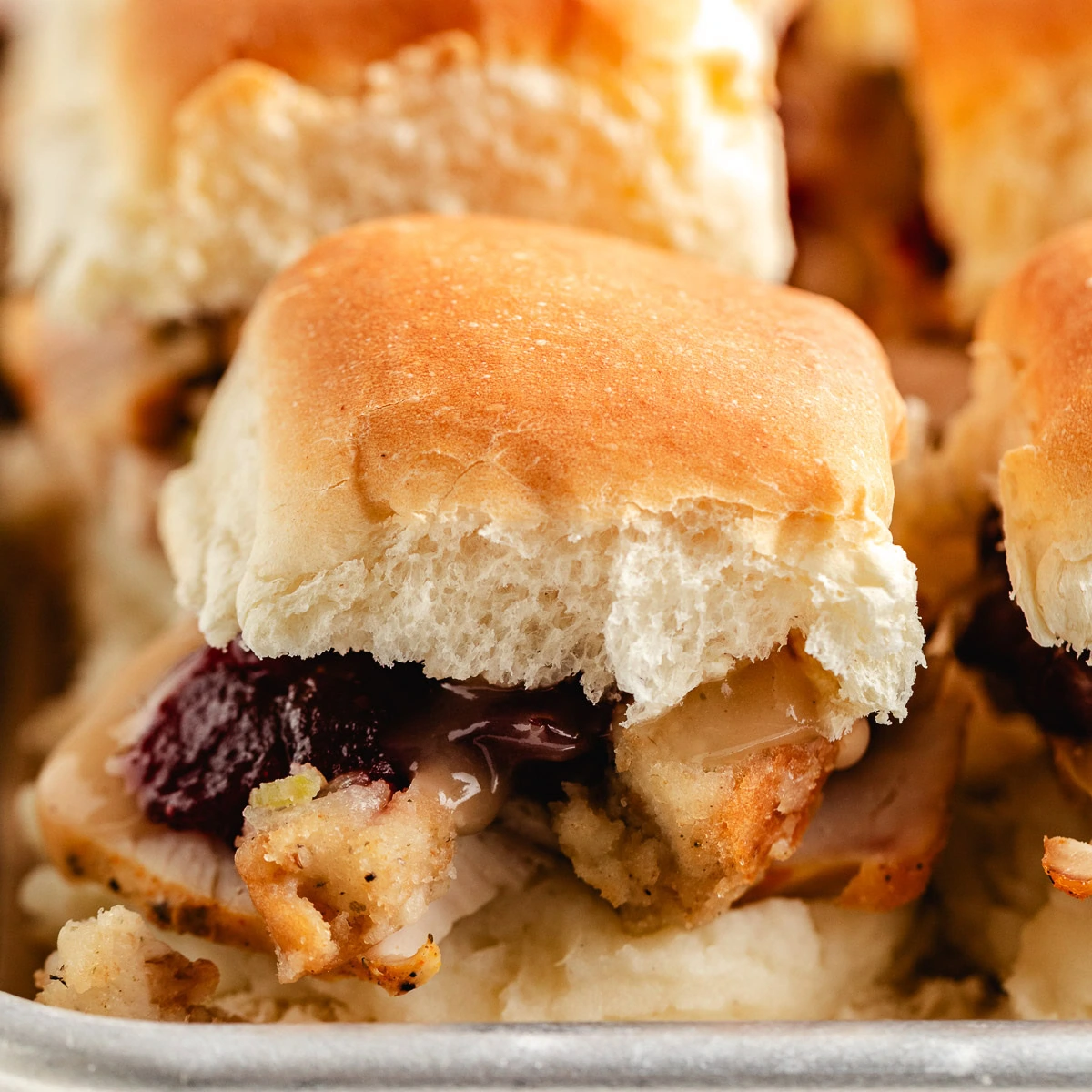 Close up view of thanksgiving sliders on a pan.