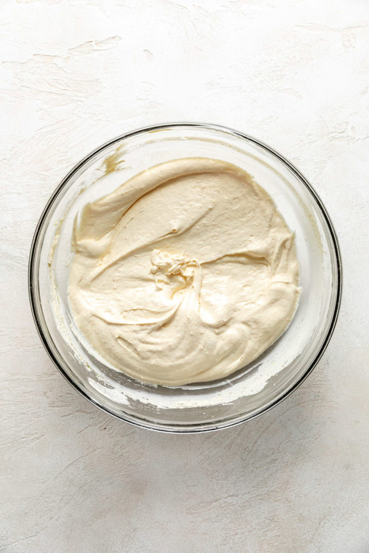 Creamy mixture in glass bowl.