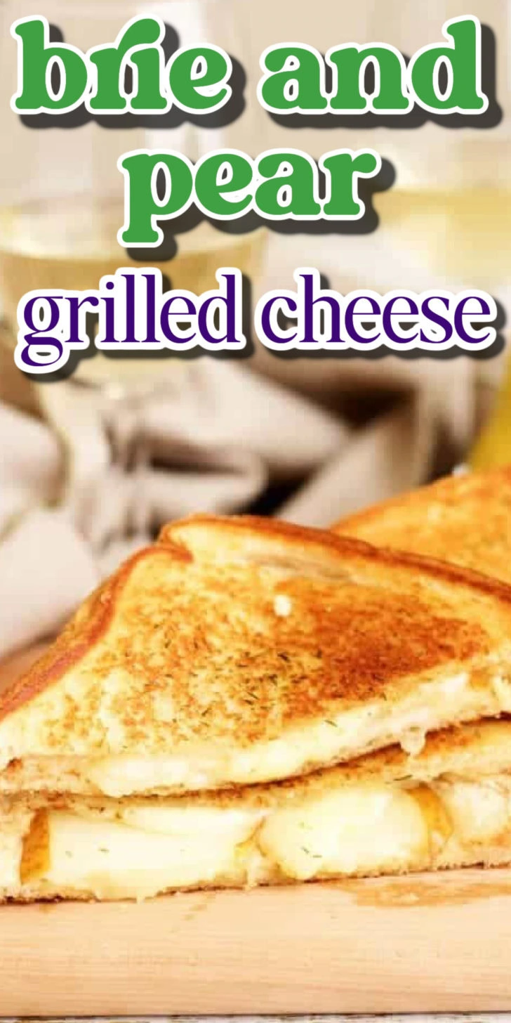 Brie and grilled cheese sandwich on a cutting board.