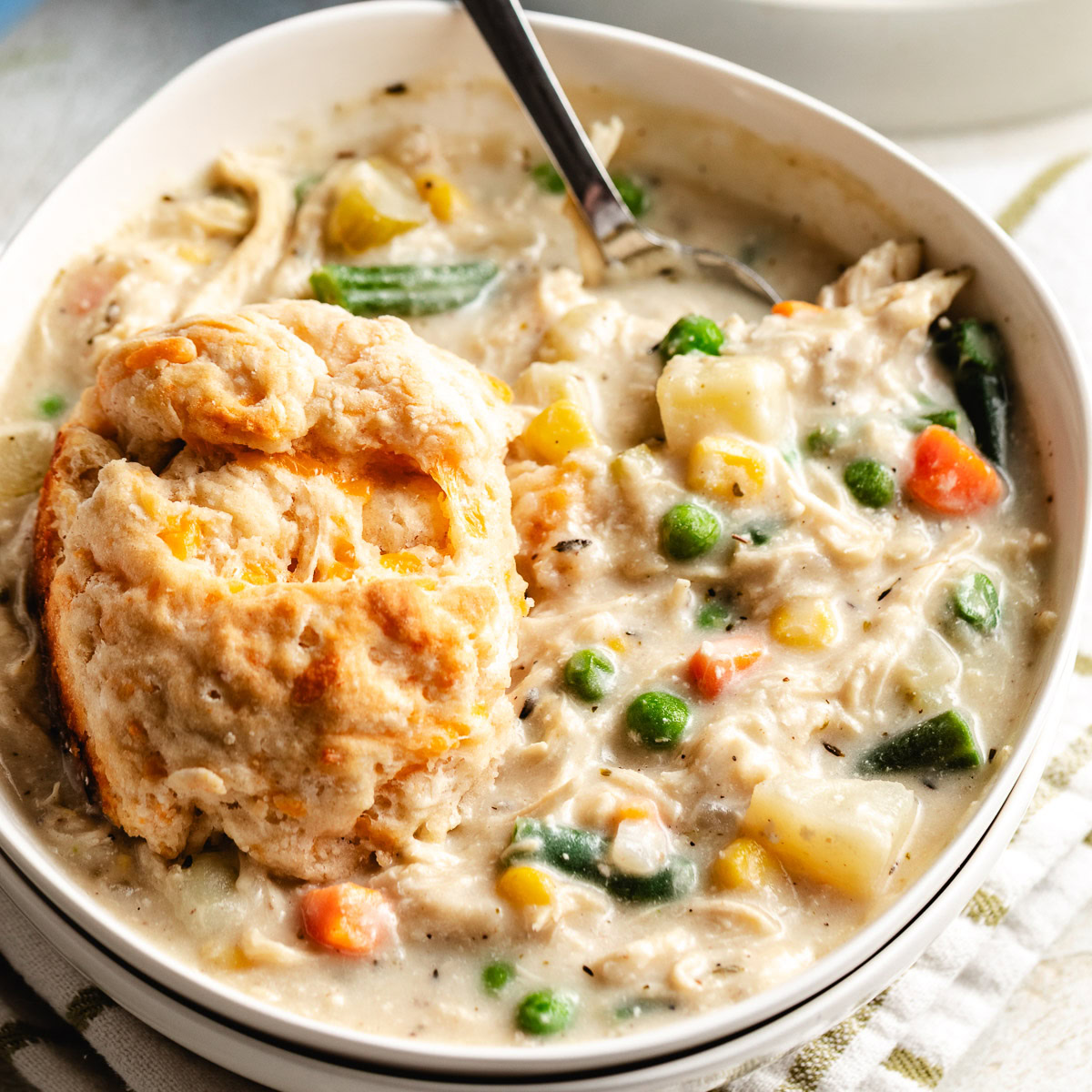 Close up view of a bowl of chicken pot pie soup.