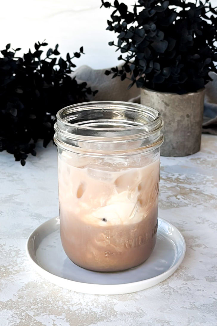 Chocolate liqueur, vodka, half and half, and simple syrup in a jar.