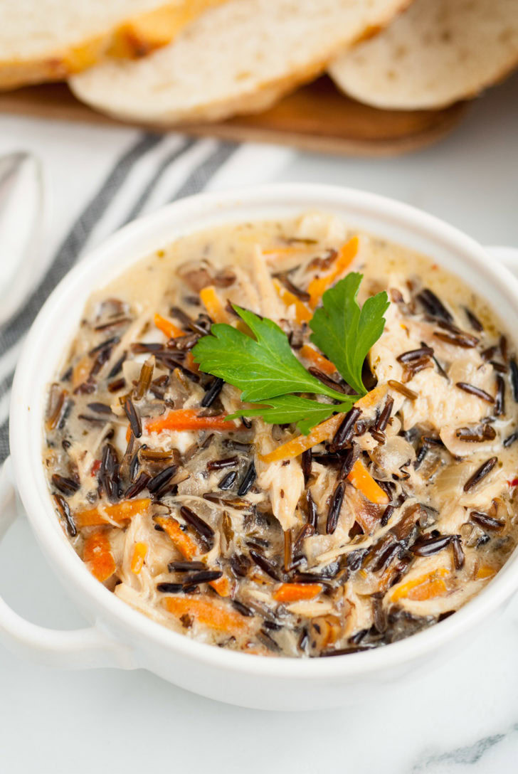 Chicken and rice soup with parsley.
