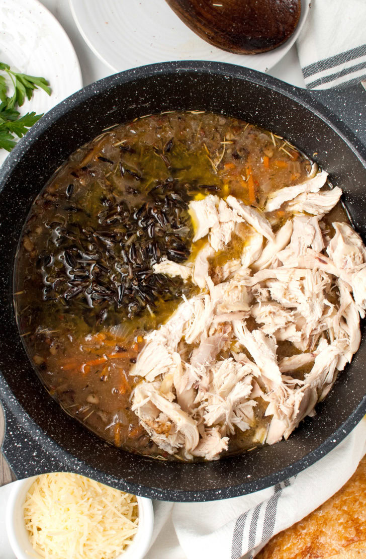 Creamy Chicken And Wild Rice Soup Chicken and rice added to broth.