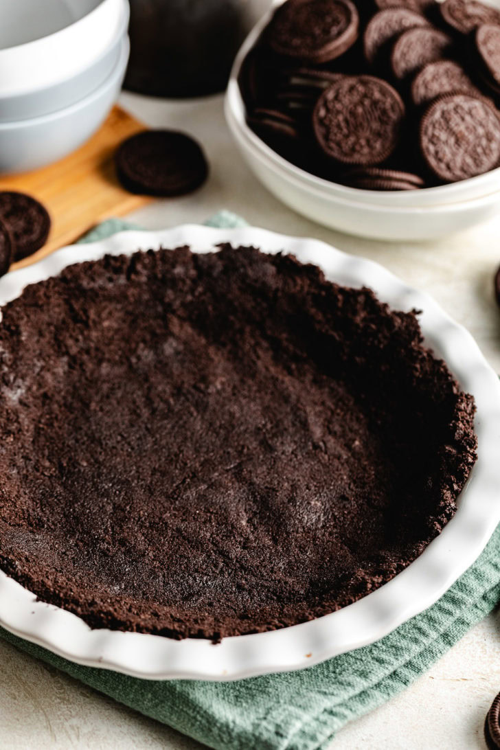 Chocolate crust in a pie plate.
