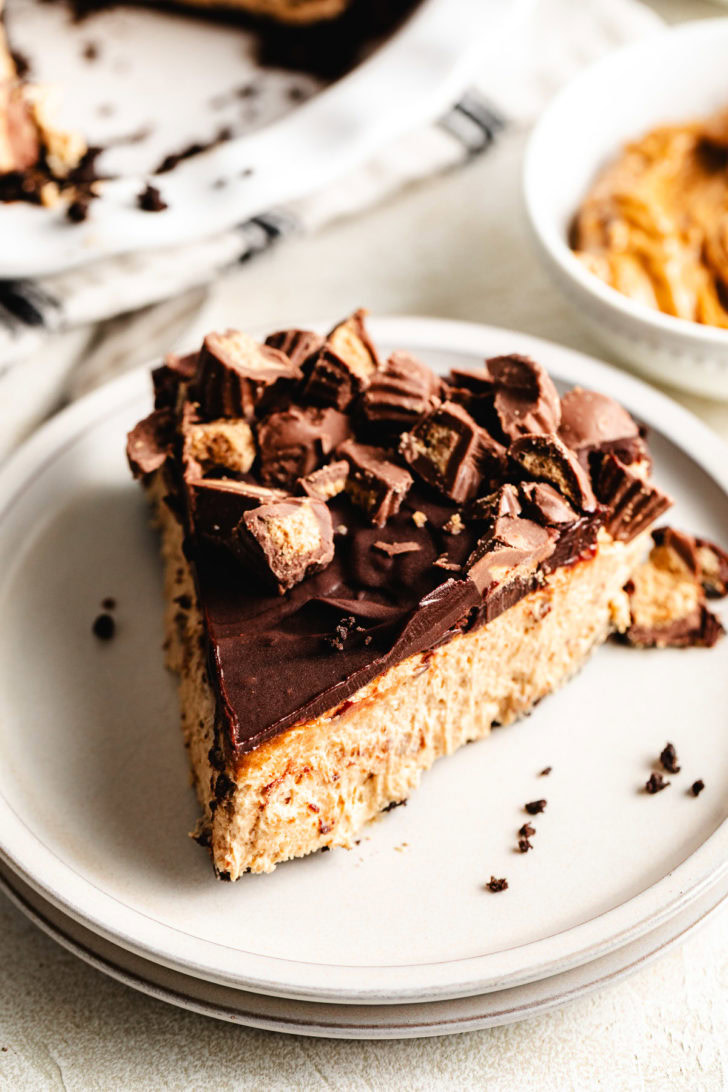 Slice of chocolate peanut butter pie on a plate.