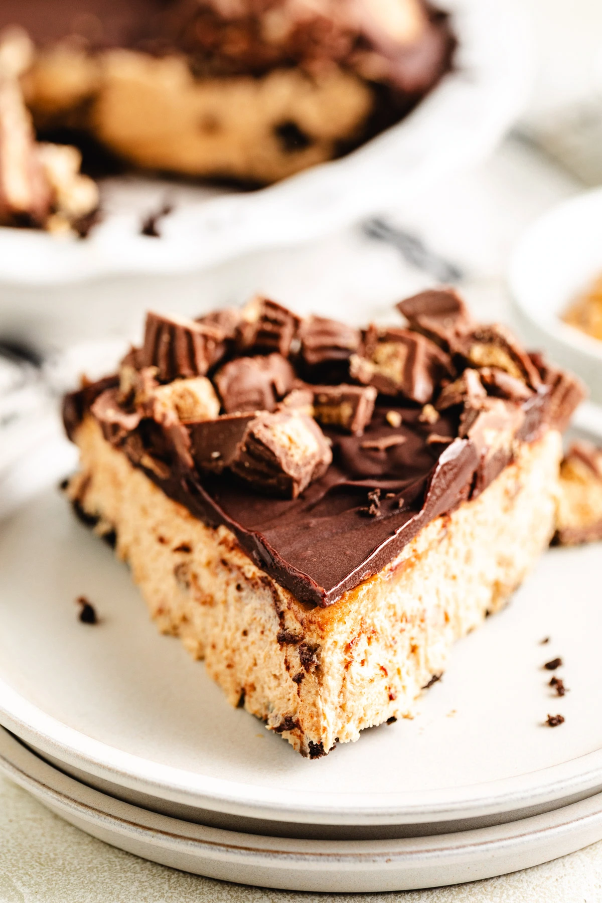Peanut butter cup pie slice on a plate.